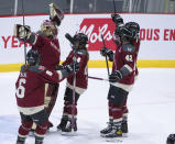 Montreal goaltender Ann-Renee Desbiens (35) and teammates celebrate a win over New York in a PWHL hockey game Wednesday, April 24, 2024, in Montreal. (Christinne Muschi/The Canadian Press via AP)