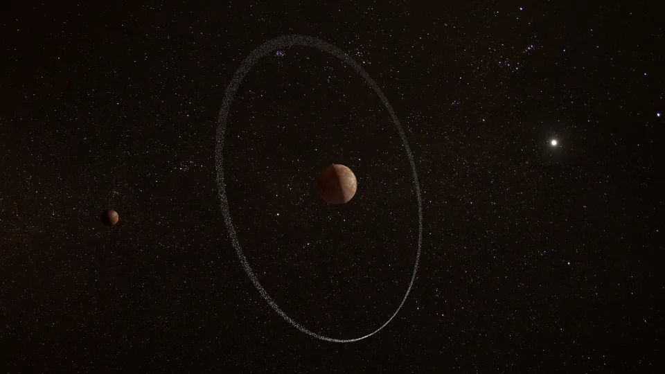 An image of Quaoar surrounded by a thin ring.