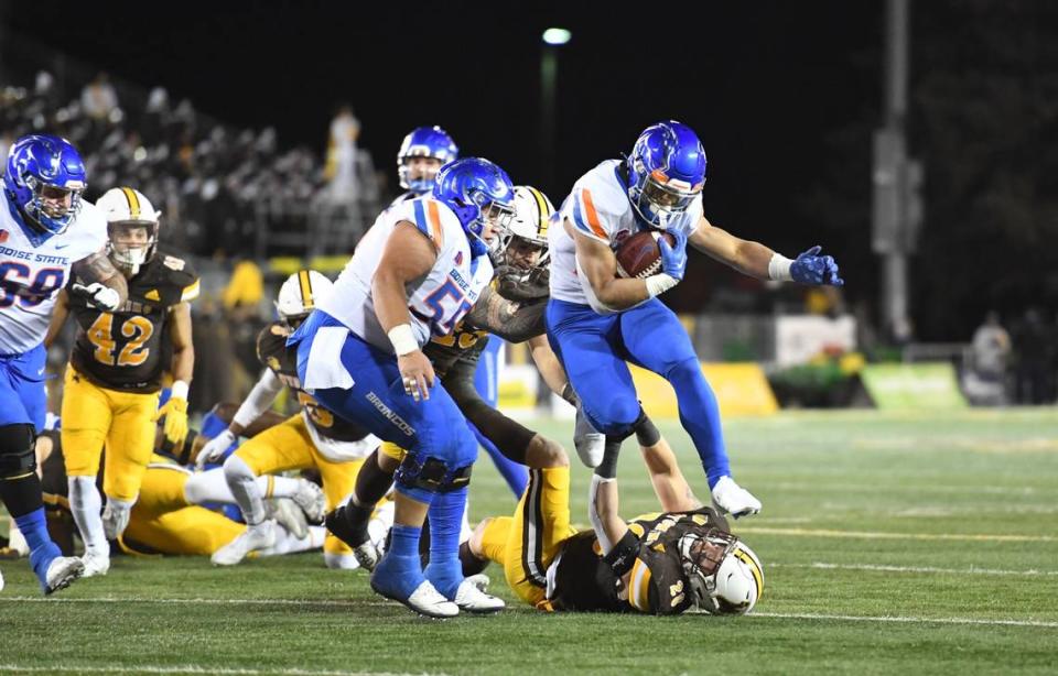 Boise State running back George Holani breaks free on a run in the first half of the Broncos’ 20-17 win at Wyoming on Saturday. He eclipsed 100 rushing yards for the fifth time in six games.