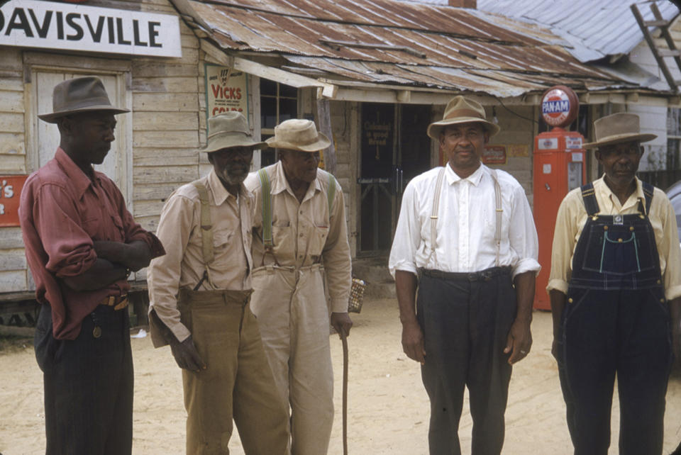 FILE - In this 1950's photo made available by the National Archives, men included in a syphilis study stand for a photo in Alabama. For 40 years starting in 1932, medical workers in the segregated South withheld treatment for Black men who were unaware they had syphilis, so doctors could track the ravages of the illness and dissect their bodies afterward. (National Archives via AP, File)