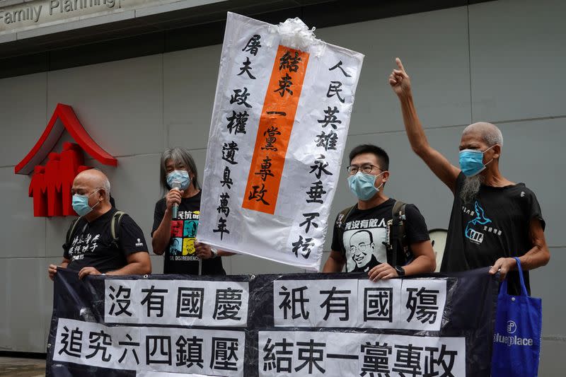 Pro-democracy protesters march during a demonstration near a flag-raising ceremony on Chinese National Day in Hong Kong