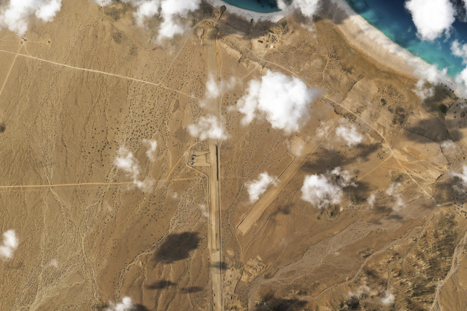 This satellite photo captured by Planet Labs PBC shows the construction of an airstrip on Abd al-Kuri Island, Yemen, Tuesday, March 26, 2024. As Yemen's Houthi rebels continue to target ships in a vital Mideast waterway, satellite pictures analyzed by The Associated Press show what appears to be a new airstrip being built at an entrance to that crucial maritime route. No country has claimed publicly the active construction taking place this month on Abd al-Kuri Island, a barren stretch of land rising out of the Indian Ocean near the mouth of the Gulf of Aden. However, satellite images shot for the AP appear to show workers have laid out "I LOVE UAE" next to the runway, an abbreviation for the United Arab Emirates. (Planet Labs PBC via AP)