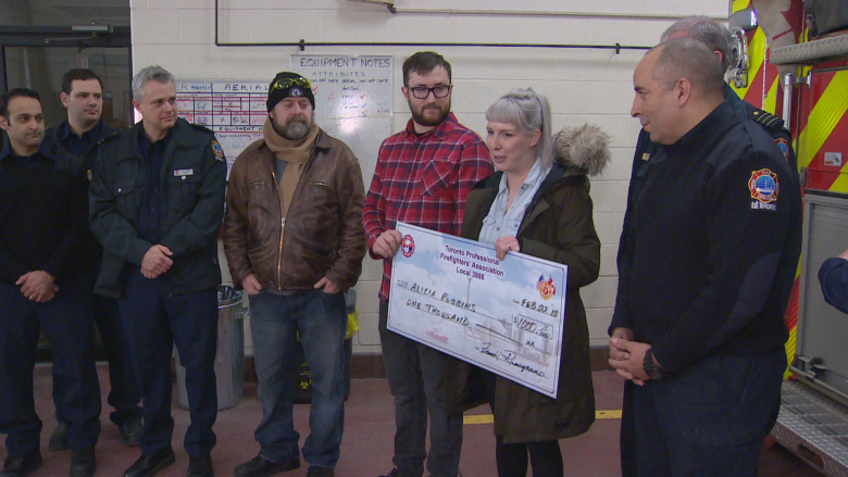 Toronto firefighters donate $1K to couple who lost belongings in house fire