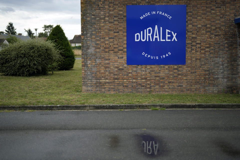 The logo of the French glassmaker Duralex is dispayed in La Chapelle Saint-Mesmin, central France, Wednesday, Sept. 7, 2022. Iconic French tableware brand Duralex is joining a growing array of European firms that are reducing and halting production because of soaring energy costs. (AP Photo/Thibault Camus)