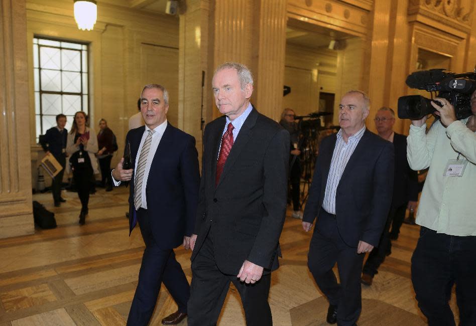 FILE - This is a Monday, Jan. 16, 2017 file photo of former deputy Northern Ireland First Minister Martin McGuinness, centre, as he arrives at Stormont, Belfast, Northern Ireland. McGuinness, an IRA and Sinn Fein leader who became a minister of peacetime Northern Ireland, has died, according to UK media, Tuesday, March 21, 2017. (AP Photo/Peter Morrison, File)