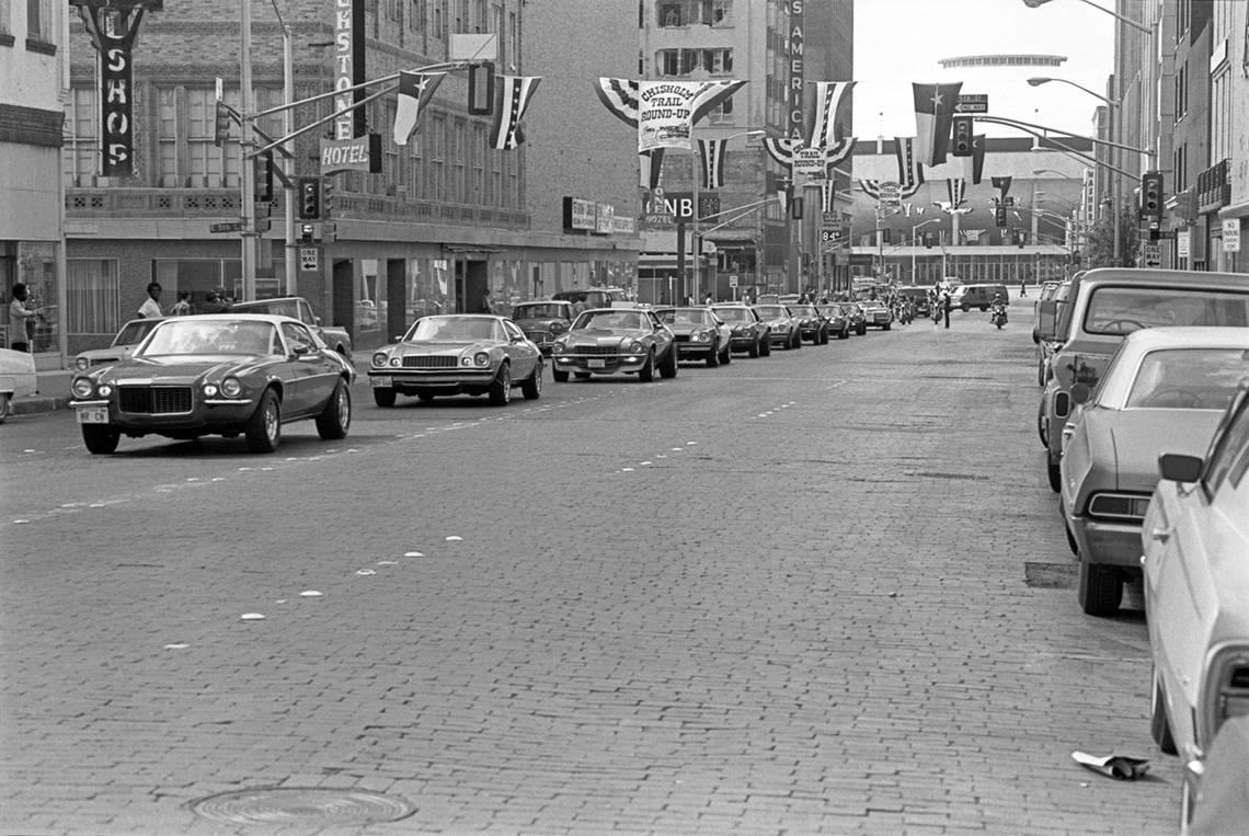 Cars line Main Street in downtown Fort Worth for the Juneteenth parade in 1978