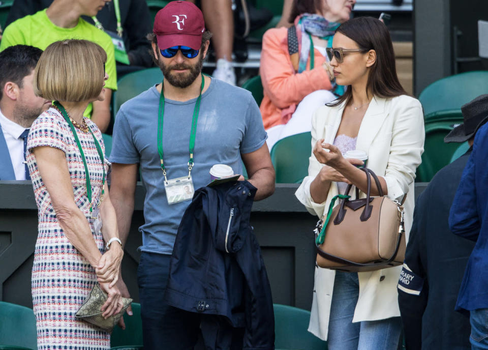 <p>While US Vogue editor-in-chief Anna Wintour took in her second tennis match, actor Bradley Cooper and his model girlfriend Irina Shayk took in their first game at the legendary sports ground. <i>[Photo: Rex]</i></p>