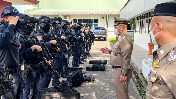 PHOTO: This handout picture taken and released by the Royal Thai Police on Oct. 6, 2022 shows National Police Chief Damrongsak Kittiprapat, second from right, speaking with a police operation team northern Thai province of Nong Bua Lam Phu. (Royal Thai Police/AFP via Getty )