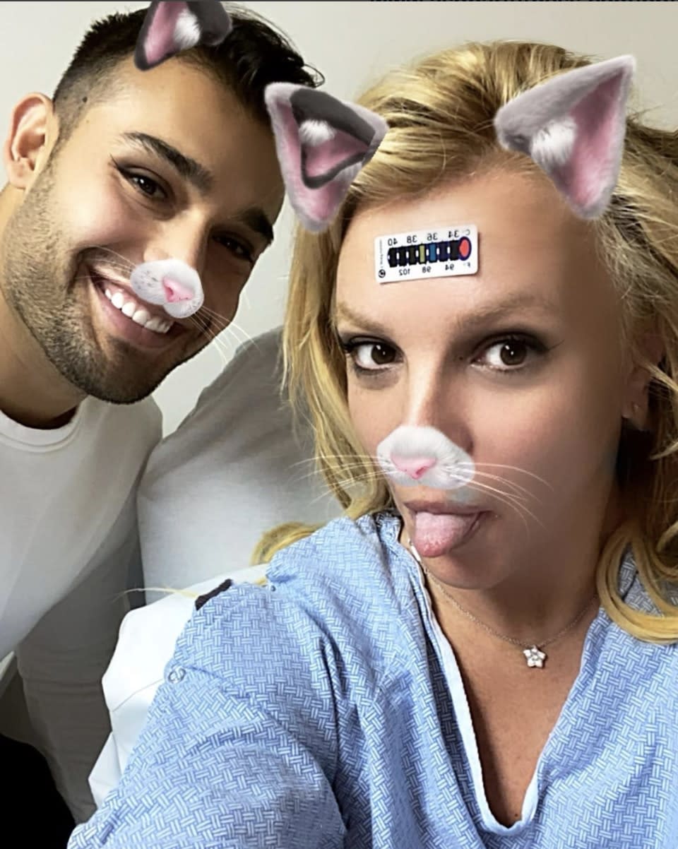 Britney Spears snaps a selfie with boyfriend Sam Asghari from her hospital bed after breaking a bone in her foot while dancing. Asghari shared a series a photos from the hospital, including one of her cast.