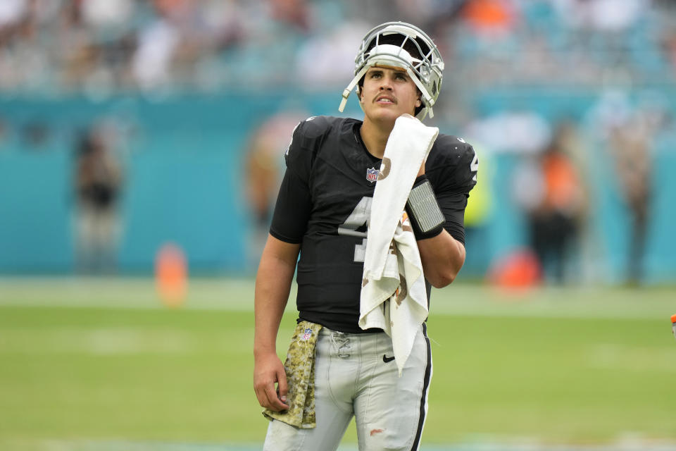 Las Vegas Raiders quarterback Aidan O'Connell (4) looks up during a time out during the second half of an NFL football game against the Miami Dolphins, Sunday, Nov. 19, 2023, in Miami Gardens, Fla. (AP Photo/Wilfredo Lee)