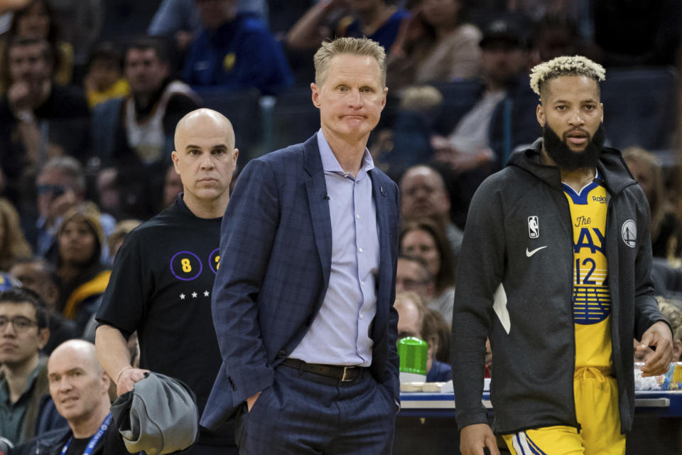 Steve Kerr on the sideline with a sad face.