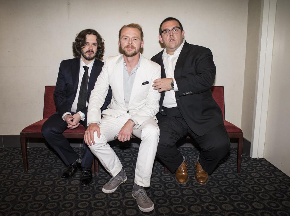 In this Wed., Aug. 21, 2013 photo, from left, director Edgar Wright, actor Simon Pegg, and actor Nick Frost pose for a portrait in the green room at the premiere of the feature film "The World's End" at the Cinerama Dome, in Los Angeles. It's not the end of the world, but "The World's End" marks a creative conclusion for Pegg, Frost and Wright. For the British trio behind "Shaun of the Dead" and "Hot Fuzz," the release on Friday, Aug. 23, 2013 of "The World's End" completes a trilogy. (Photo by Dan Steinberg/Invision/AP)