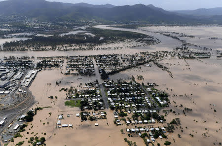 Houses are surrounded by floodwaters in the aftermath of Cyclone Debbie at Depot Hill in Rockhampton, Australia, April 6, 2017. AAP/Dan Peled/via REUTERS