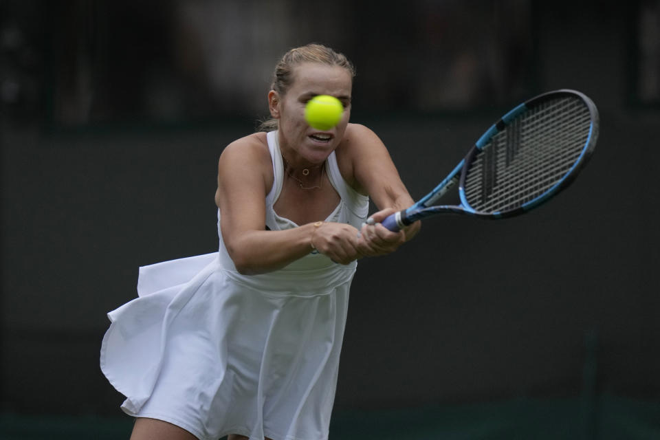 Sofia Kenin of the US plays a return to Coco Gauff of the US during the first round women's singles match on day one of the Wimbledon tennis championships in London, Monday, July 3, 2023. (AP Photo/Alastair Grant)