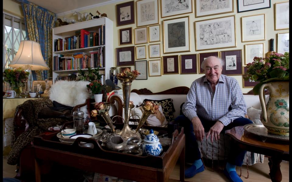 Cricket commentator Henry Blofeld surrounded by memorabilia at his London home - Credit: Martin Pope/The Telegraph