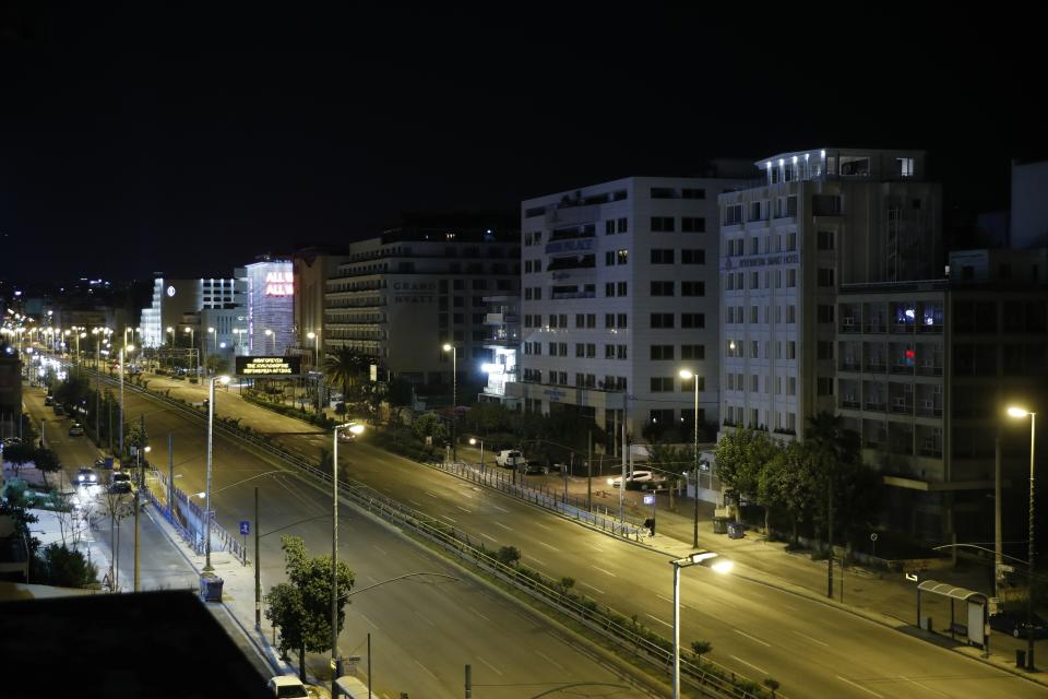 In this Thursday, April 2, 2020 photo, four hotels are closed in Syngrou avenue, in Athens, during the lockdown. Deserted squares, padlocked parks, empty avenues where cars were once jammed bumper-to-bumper in heavy traffic. The Greek capital, like so many cities across the world, has seen its streets empty as part of a lockdown designed to stem the spread of the new coronavirus. (AP Photo/Thanassis Stavrakis)