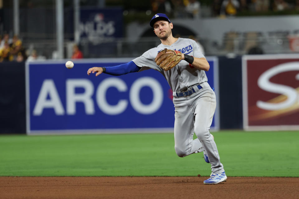 SAN DIEGO, CA - OCTOBER 14:   Trea Turner #6 of the Los Angeles Dodgers throws to first in the seventh inning during the game between the Los Angeles Dodgers and the San Diego Padres at Petco Park on Friday, October 14, 2022 in San Diego, California. (Photo by Rob Leiter/MLB Photos via Getty Images)