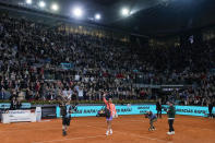 Rafael Nadal, of Spain, center, waves to the crowd after losing a match against Jiri Lehecka, of Czech Republic, during the Mutua Madrid Open tennis tournament in Madrid, Tuesday, April 30, 2024. (AP Photo/Manu Fernandez)