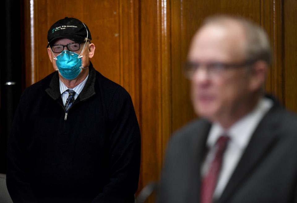 Worcester Medical Director Dr. Michael P. Hirsh listens as Mayor Joseph M. Petty delivers an update on the status of COVID-19 in the city Friday at City Hall.