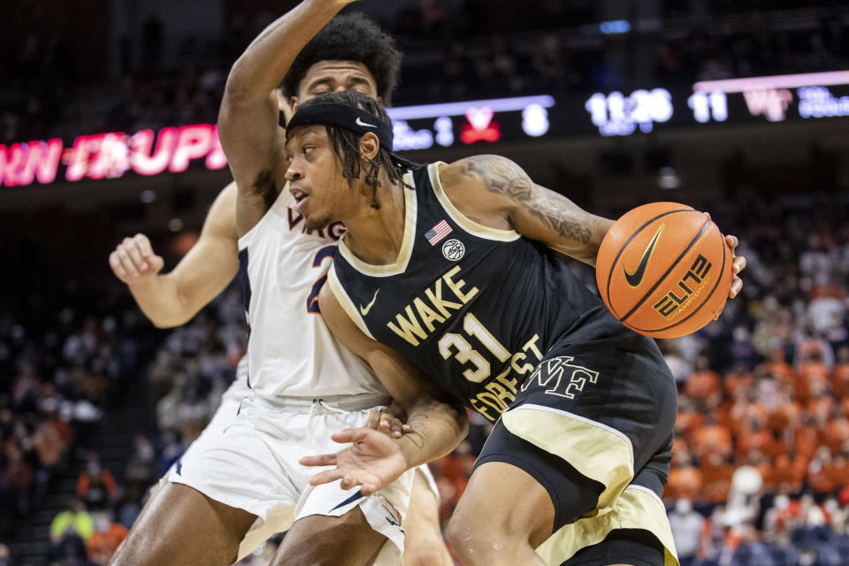 Wake Forest's Alondes Williams (31) drives during the first half of an NCAA college basketball game against Virginia in Charlottesville, Va., Sat, Jan. 15, 2022. (AP Photo/Erin Edgerton)