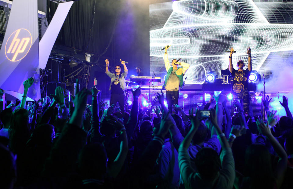 In this photo provided by HP, Far East Movement performs to celebrate the launch of HP's new line of Windows 8 touch-technology products Wednesday, Oct. 24, 2012 in New York. On Thursday in New York, Microsoft will unveil a dramatic overhaul of its ubiquitous Windows operating system. (AP Photo/HP)