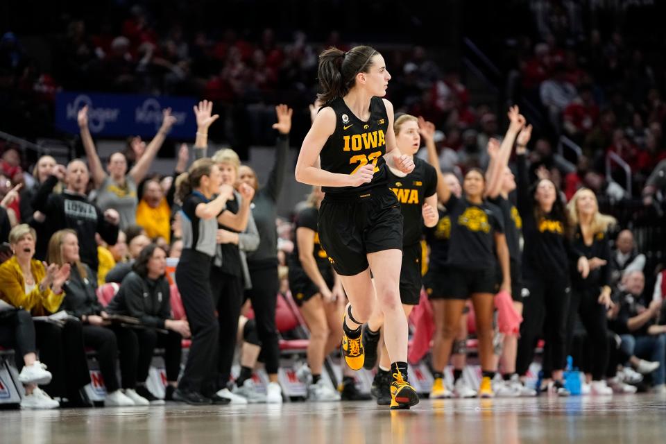 Iowa guard Caitlin Clark heads up court after making a 3-pointer against Ohio State on Jan. 23.