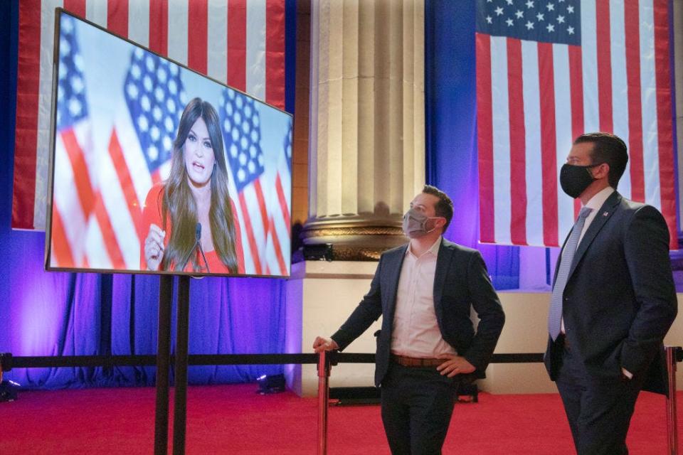 Donald Trump Jr. watches Kimberly Guilfoyle as she pre-records her address to the Republican National Convention in August 2020.