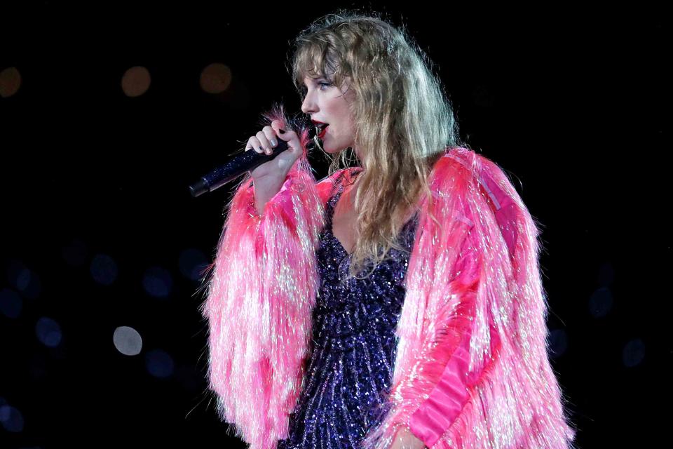 <p>Octavio Jones/TAS23/Getty for TAS Rights Management</p> Taylor Swift performing in Tampa, Florida in April 2023