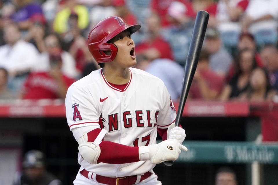 Los Angeles Angels' Shohei Ohtani yells after a wild pitch that allowed David Fletcher to advance to second during the first inning of a baseball game against the Colorado Rockies Monday, July 26, 2021, in Anaheim, Calif. (AP Photo/Mark J. Terrill)