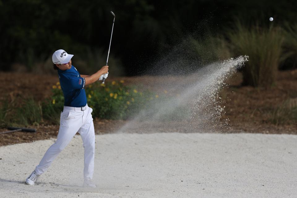 Min Woo Lee hits from the bunker of hole 14 during the fourth and final round of The Players golf tournament Sunday, March 12, 2023 at TPC Sawgrass in Ponte Vedra Beach, Fla. Scottie Scheffler of Dallas won the tournament at 17 under par with Tyrell Hatton at 12 under par as runner-up. [Corey Perrine/Florida Times-Union]