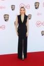 <p>Always a fabulous addition to any red carpet, Jodie Comer turned heads on at the 2022 BAFTA TV Awards wearing a chic, black, tuxedo-inspired gown by Boss. The design featured a low neck and a subtle slit up the leg. She teamed it with a diamond necklace by Messika and platform Jimmy Choos.</p>