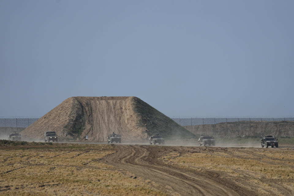 Israeli forces move near the Gaza Strip border in southern Israel, Thursday, Jan. 25, 2024. The army is battling Palestinian militants across Gaza in the war ignited by Hamas' Oct. 7 attack into Israel. (AP Photo/Ohad Zwigenberg)