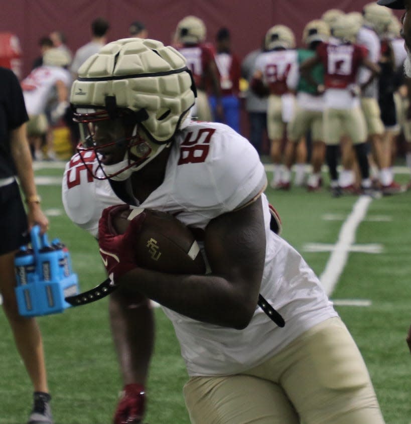 FSU tight end Markeston Douglas runs through a drill during the Seminoles' sixth spring practice on Thursday, March 24, 2022.