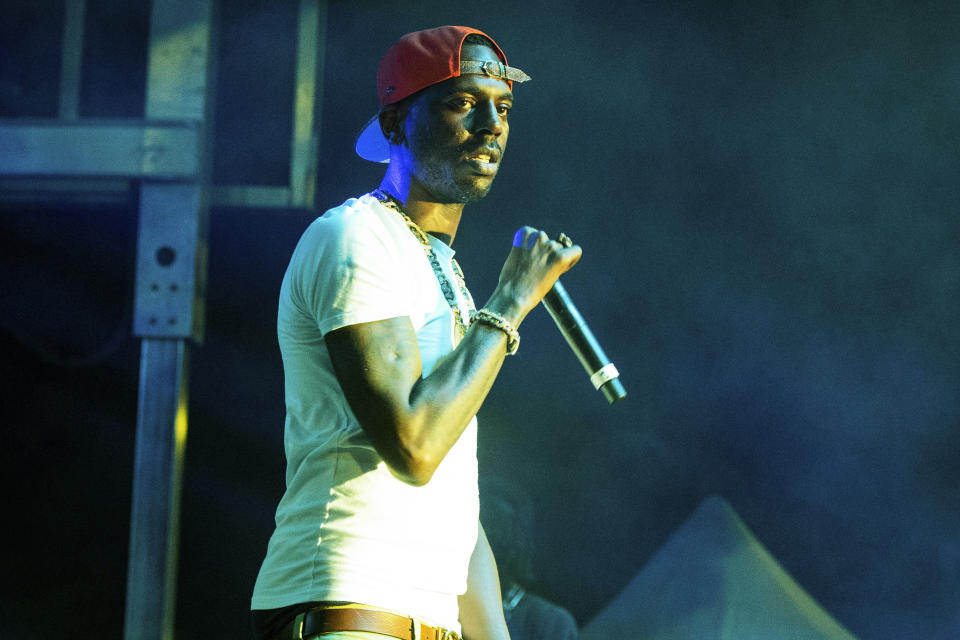 FILE - Young Dolph performs at The Parking Lot Concert in Atlanta on Aug. 23, 2020. An arrest warrant has been issued for Justin Johnson, 23, in connection with the Nov. 17, 2021, fatal shooting of rapper Young Dolph, who was gunned down in a daylight ambush at a popular cookie shop in his hometown of Memphis, authorities said Wednesday, Jan. 5, 2022. (Photo by Paul R. Giunta/Invision/AP, File)