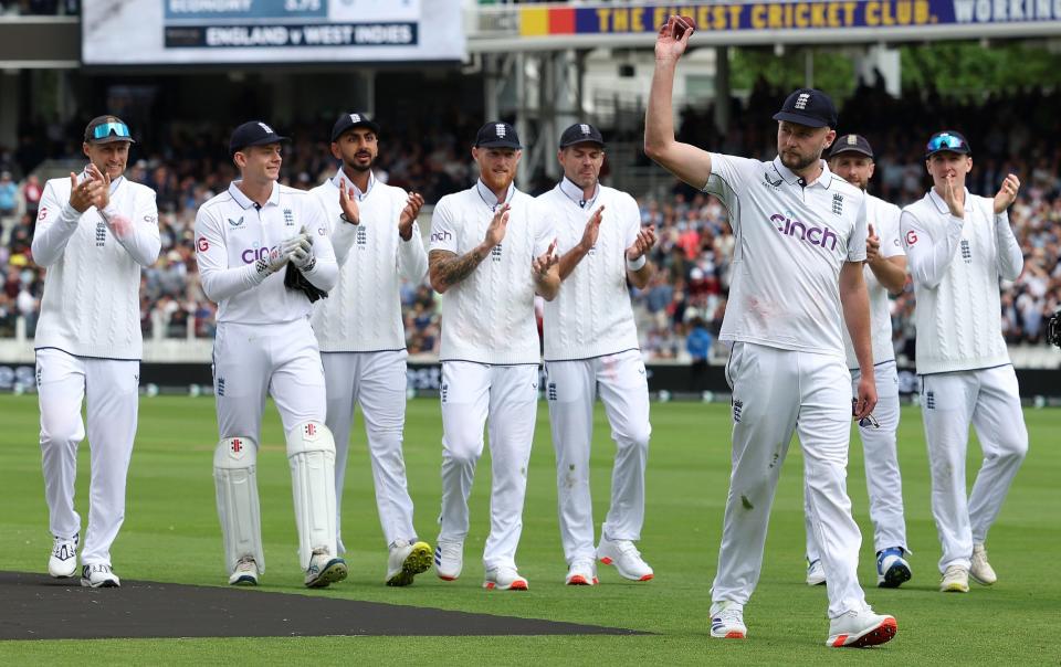 The debutant Gus Atkinson leads England off the field