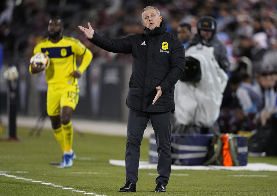 Nashville SC head coach Gary Smith, front, directs his players against the Colorado Rapids during the first half of an MLS soccer match Saturday, March 2, 2024, in Commerce City, Colo. (AP Photo/David Zalubowski)