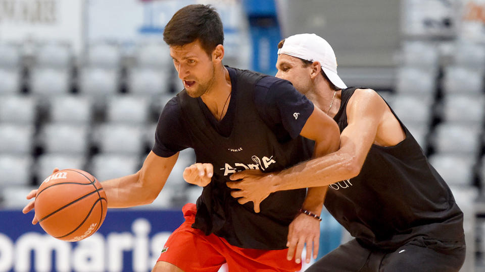 Pictured here, tennis rivals Novak Djokovic and Grigor Dimitrov playing basketball together.
