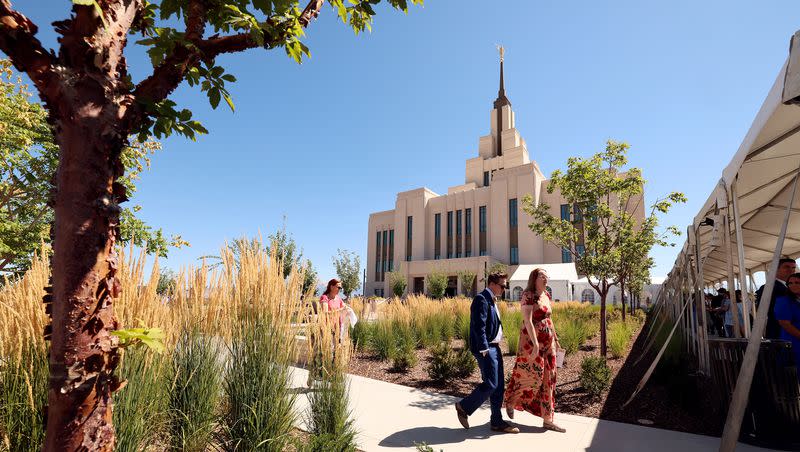 People walk after the first session of the dedication of the Saratoga Springs Utah Temple in Saratoga Springs, Utah, on Sunday, Aug. 13, 2023.