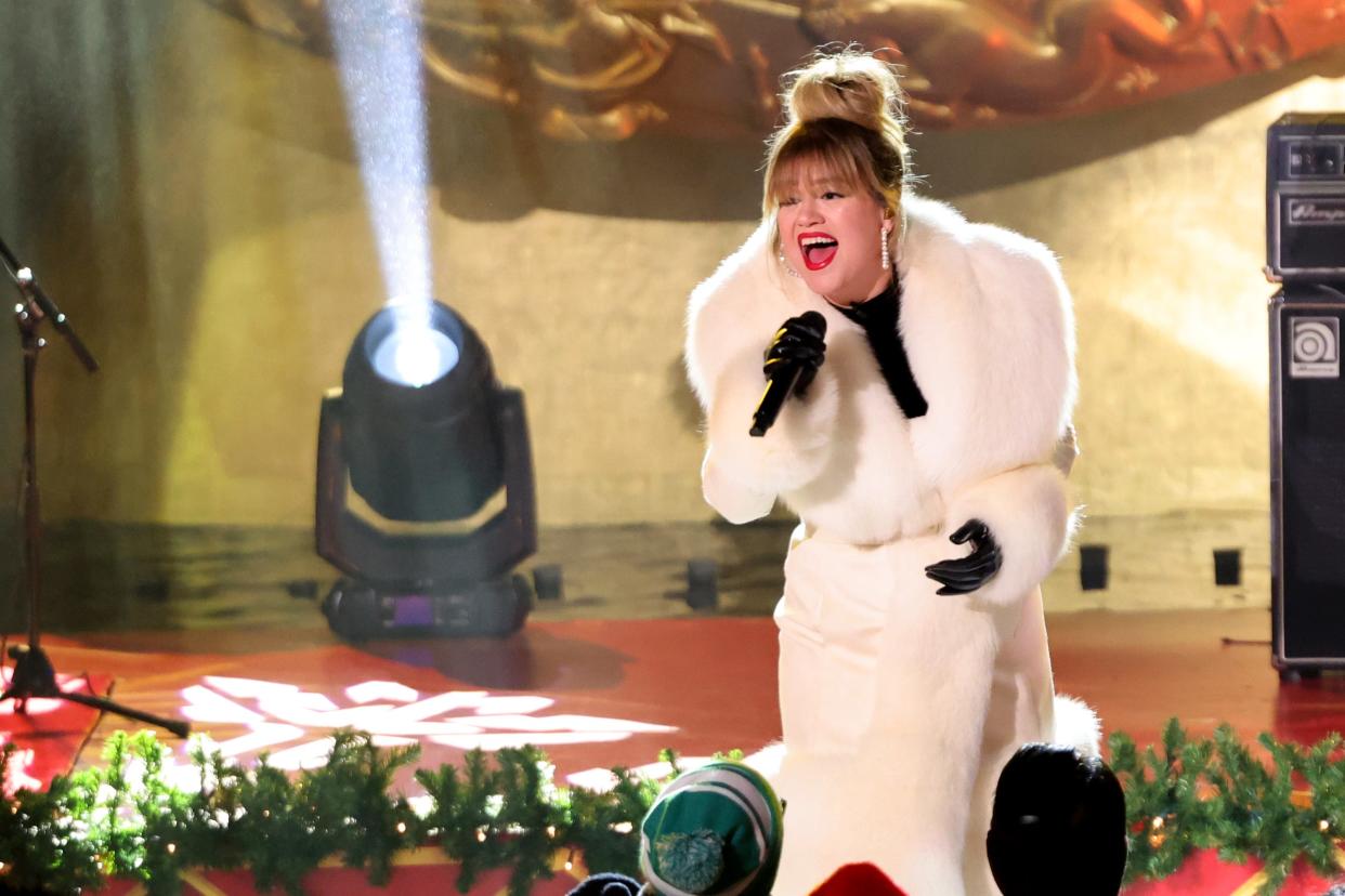 Kelly Clarkson, shown here at the November Rockefeller Center tree-lighting ceremony, was a no-show at the Daytime Emmy Awards but won her third consecutive talk-show honor.