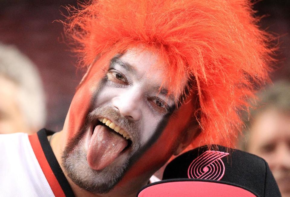 Portland Trail Blazers fan Jeremy Hubbard celebrates before the start of Game 3 of a Western Conference semifinal NBA basketball playoff series against the San Antonio Spurs, Saturday, May 10, 2014, in Portland, Ore. (AP Photo/Rick Bowmer)