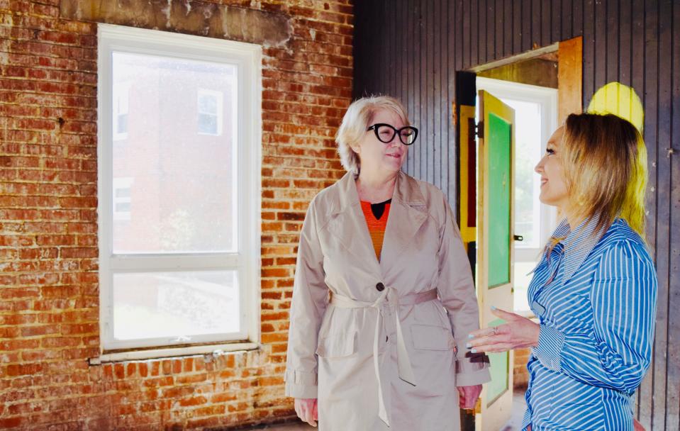 Washington County Museum of Fine Arts Director Sarah Hall, left, discusses expansion plans with Education Director Kellie Mele in the former Bock Oil building that will become the museum's new education center.