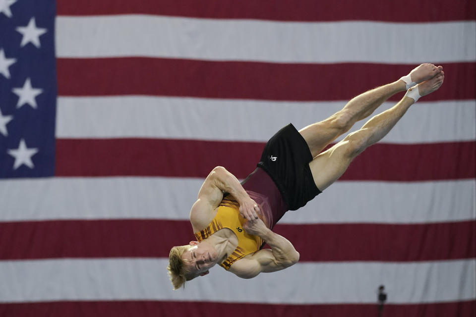 FILE - Shane Wiskus competes during the Winter Cup gymnastics competition in Indianapolis, in this Friday, Feb. 26, 2021, file photo. Three-quarters of the 613-person U.S. Olympic team competed in the American collegiate system. That's the most up-to-date number to illustrate the country’s dependence on the NCAA and other college programs to bring home medals. (AP Photo/Darron Cummings, File)