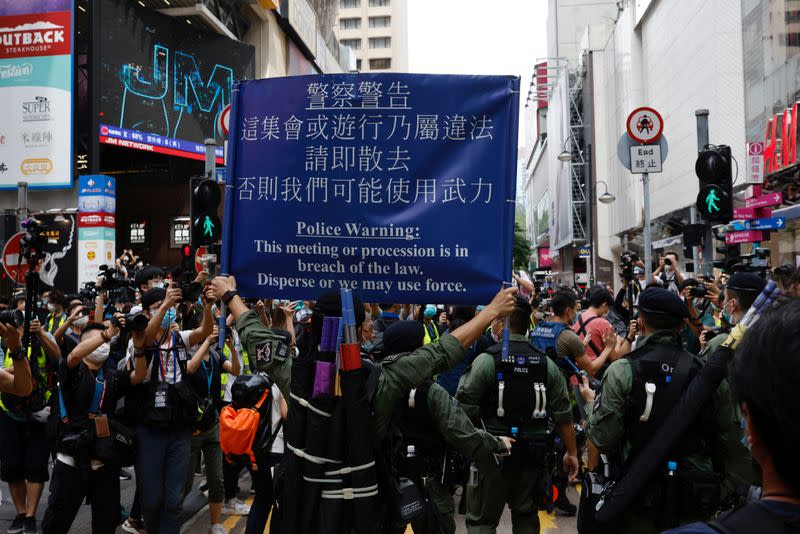 Police ask people to leave to avoid mass gathering during a protest in Hong Kong