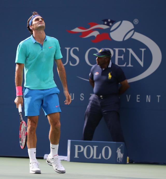 Roger Federer reacts after a shot against Marin Cilic during the U.S. Open semi-finals. (AP Photo/Mike Groll)