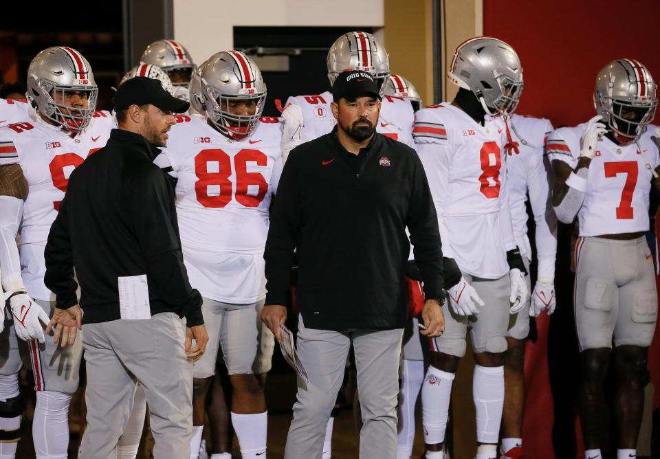 Ohio State Buckeyes head coach Ryan Day prepares to lead his team on the field during the NCAA football game against the Indiana Hoosiers at Memorial Stadium