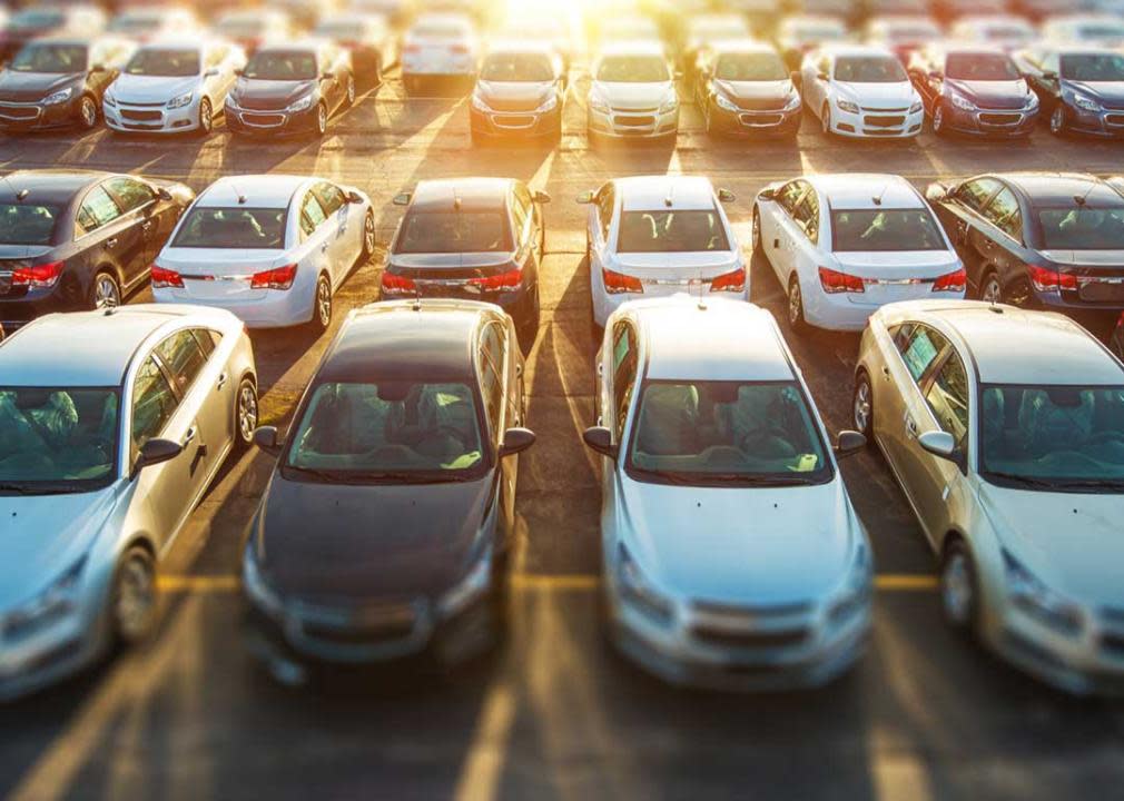 dealer lot with assortment of new cars