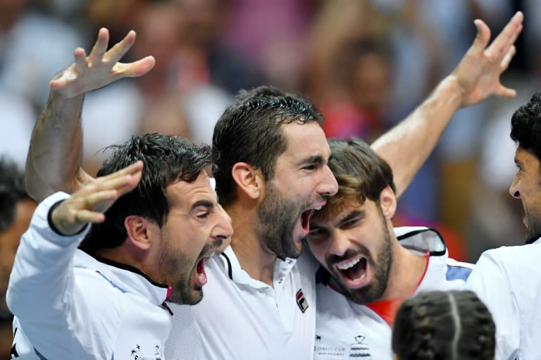 Croatia's Marin Cilic (C) celebrates with teammates after winning against France's Richard Gasquet in the Davis Cup World Group semifinals in Zadar on September 18, 2016