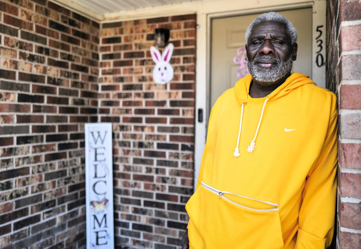 Autumn Ridge resident Harvey Edwards stands on his Easter decorated stoop Sunday, April 9, 2023. He and his wife  just moved into the complex in March and are considering placing their rent in escrow until all the issues are resolved.