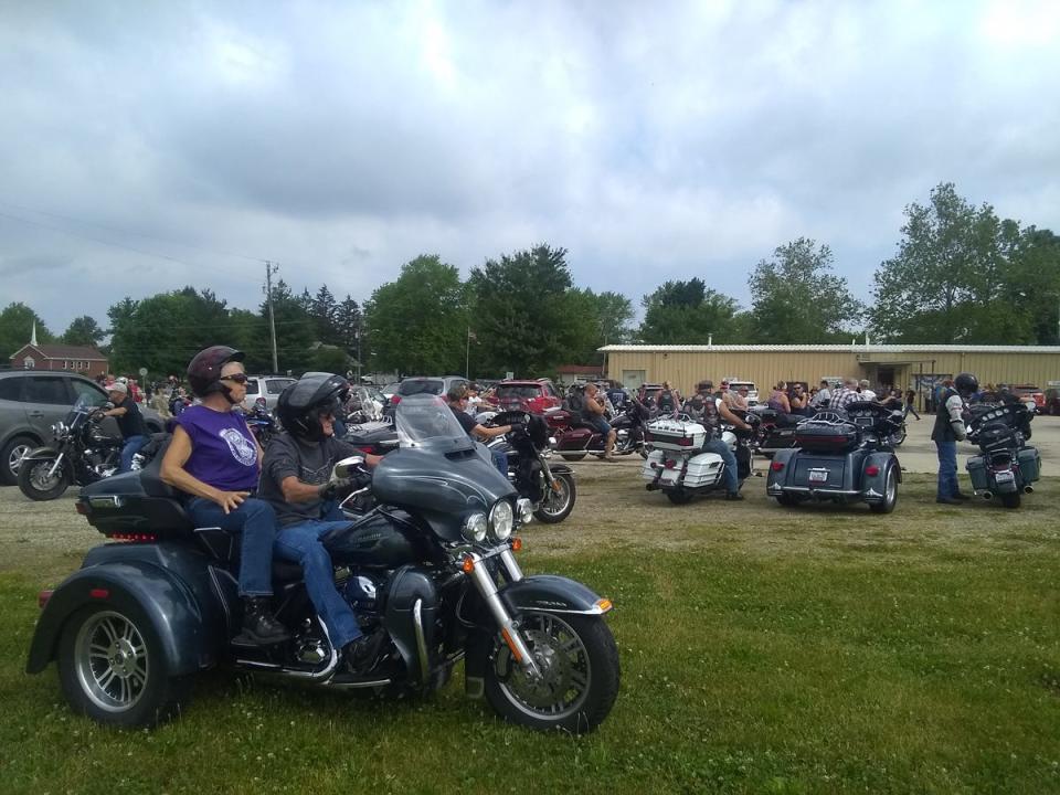 Motorcycles lined up on the grass in preparation for the start of Silvie's Ride during the 2021 event.