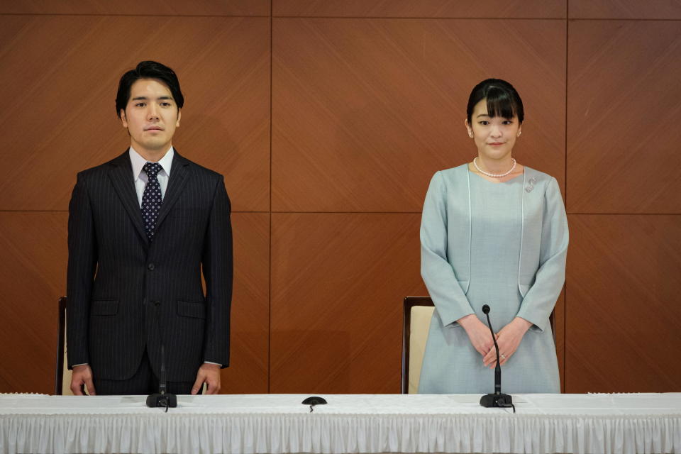 Japan's former Princess Mako and her new husband, Kei Komuro, at a news conference to announce their marriage registration at the Grand Arc Hotel in Tokyo on October 26, 2021. / Credit: Nicolas Datiche/Pool via Reuters